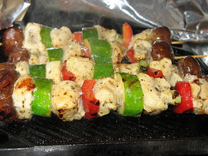 chicken kabobs on a grill