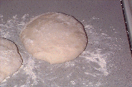 shaping pizza dough for the second proof